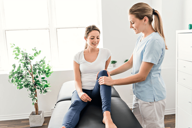 A woman is receiving a massage from a physical therapist in Chatswood.